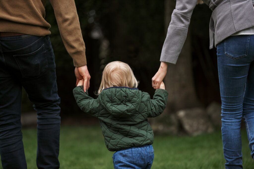 parents walkig with child